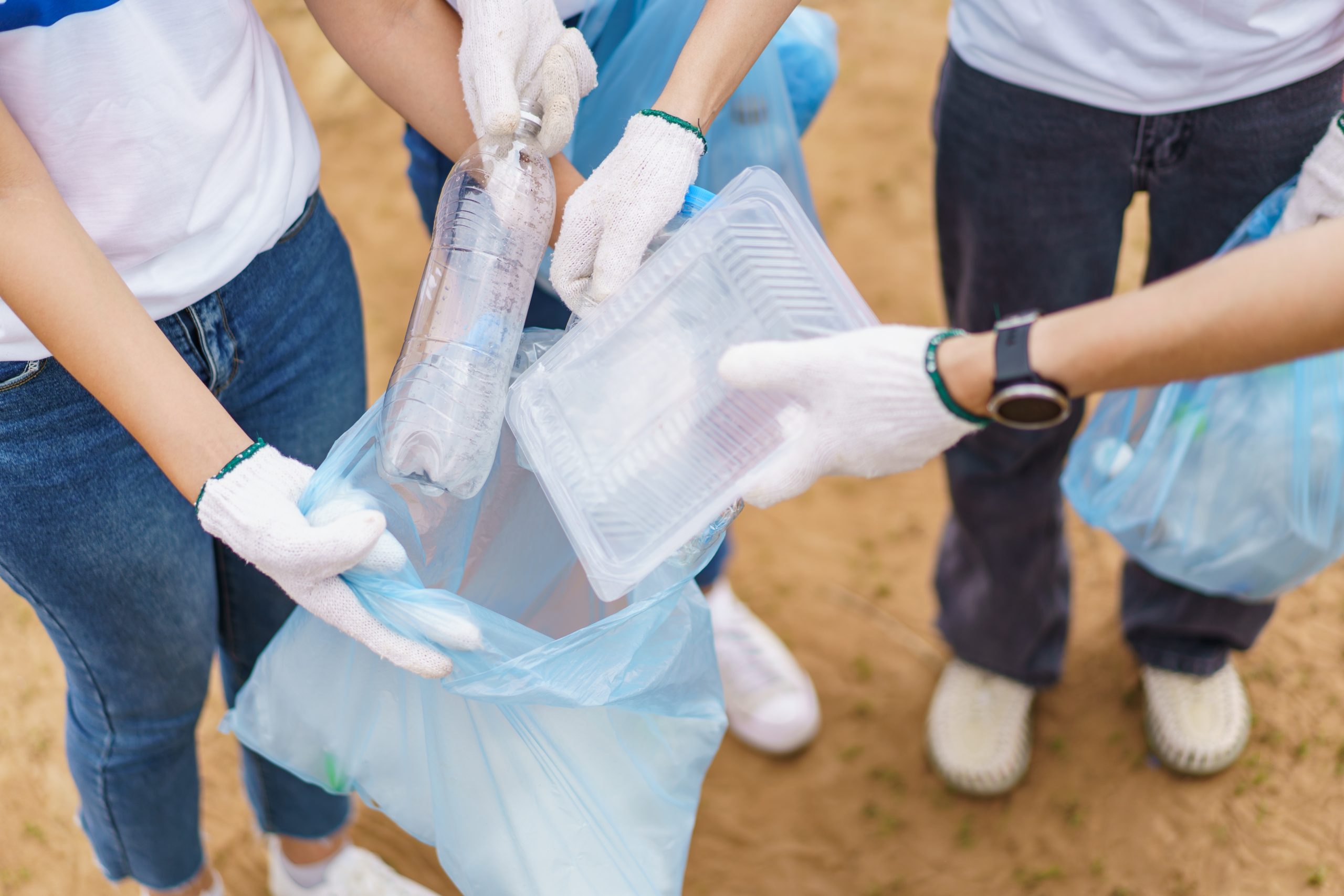 group,of,asian,people,volunteer,stacking,their,hands,together,for